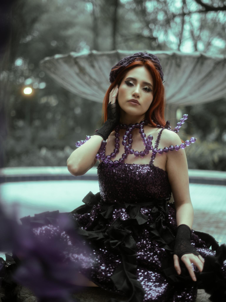 Stunning avant-garde fashion photo set in a garden with elegant details.